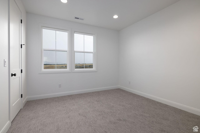 6527 W Barneys Creek Way, West Jordan, UT 84081 - spare room featuring light colored carpet, baseboards, and recessed lighting