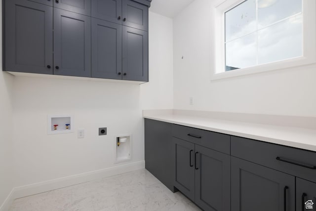 6527 W Barneys Creek Way, West Jordan, UT 84081 - washroom featuring cabinet space, hookup for an electric dryer, hookup for a washing machine, baseboards, and light marble finish flooring