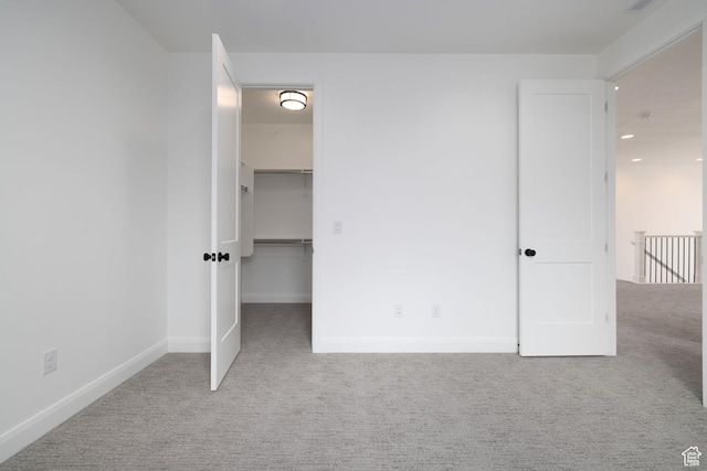 6527 W Barneys Creek Way, West Jordan, UT 84081 - unfurnished bedroom featuring carpet floors, a walk in closet, baseboards, and recessed lighting