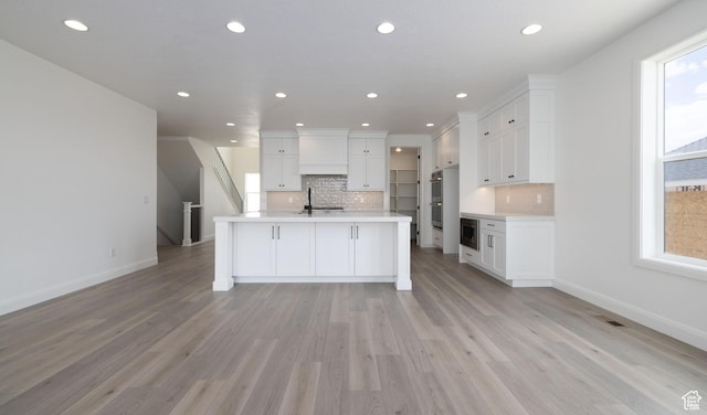6527 W Barneys Creek Way, West Jordan, UT 84081 - kitchen with backsplash, light countertops, white cabinetry, recessed lighting, and stainless steel appliances