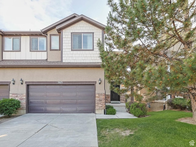 2671 N Garden Dr, Lehi, UT 84043 - view of front of house with stone siding, a front yard, driveway, a garage, and stucco siding