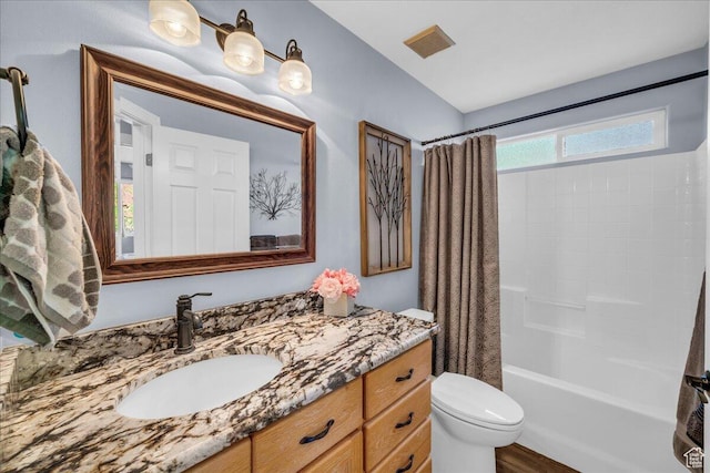 1050 W Red Hills Pkwy Unit 100A, Washington, UT 84780 - bathroom featuring vanity, toilet, shower / tub combo, and wood finished floors