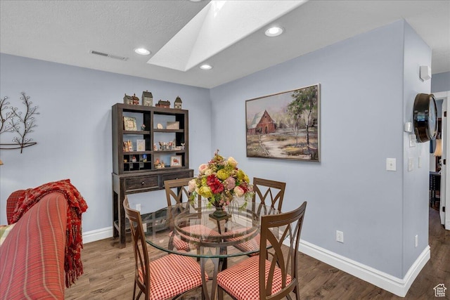 1050 W Red Hills Pkwy Unit 100A, Washington, UT 84780 - dining area with a skylight, wood finished floors, baseboards, and recessed lighting