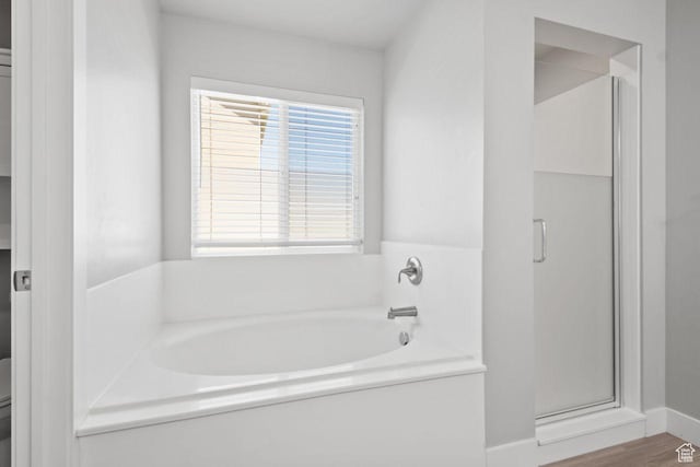 4972 N Sage Park Dr, Eagle Mountain, UT 84005 - bathroom with a garden tub, a stall shower, toilet, and baseboards