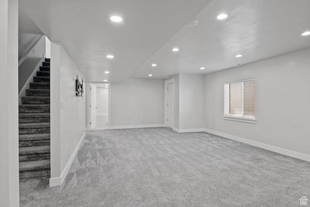 4972 N Sage Park Dr, Eagle Mountain, UT 84005 - below grade area with recessed lighting, carpet flooring, stairway, and baseboards