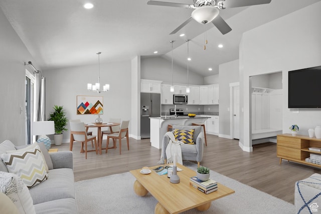4972 N Sage Park Dr, Eagle Mountain, UT 84005 - living room featuring light wood-style floors, baseboards, ceiling fan, a chandelier, and recessed lighting