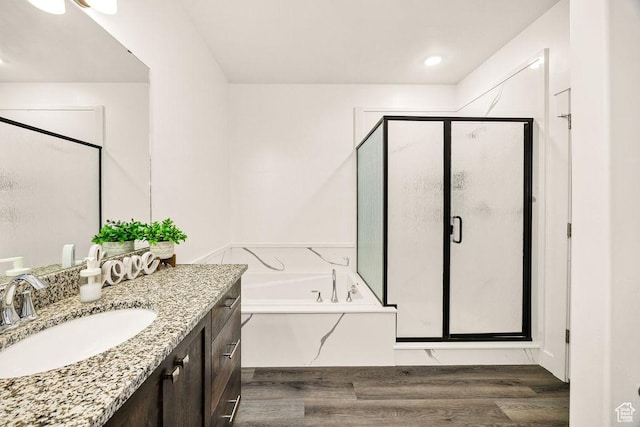 460 E 535 S, Hyrum, UT 84319 - full bath with wood finished floors, vanity, a shower stall, and a garden tub
