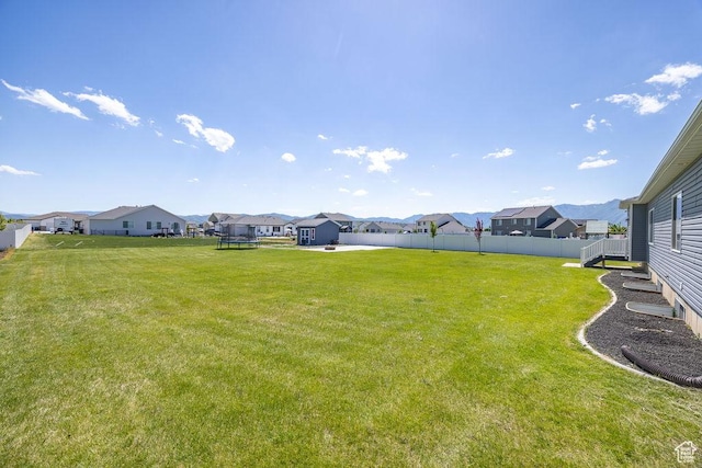 460 E 535 S, Hyrum, UT 84319 - view of yard featuring a residential view and a trampoline