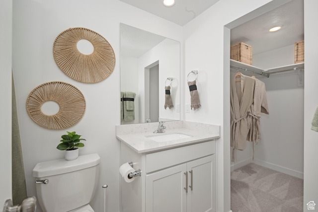 224 N Loring Ave Unit 112, Santaquin, UT 84655 - bathroom featuring toilet, vanity, baseboards, and recessed lighting