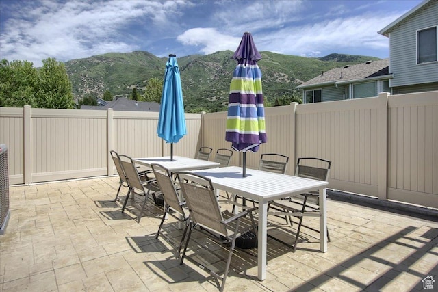 7939 S 2450 E, South Weber, UT 84405 - view of patio / terrace with outdoor dining area and a mountain view