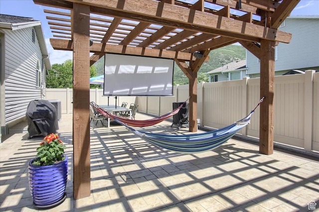7939 S 2450 E, South Weber, UT 84405 - fenced backyard featuring outdoor dining space, a patio area, and a pergola