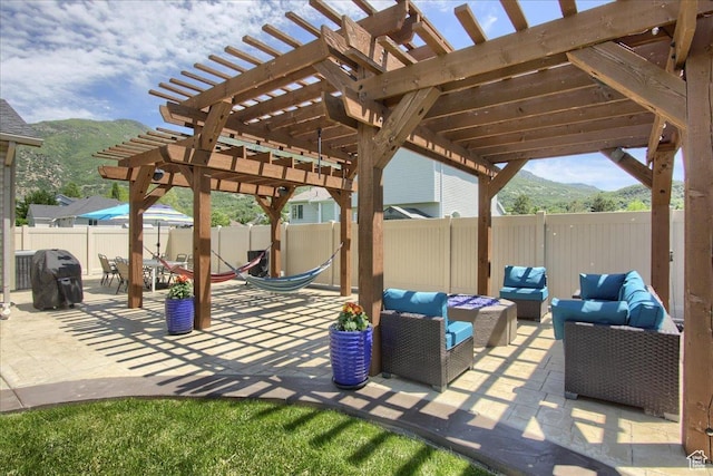 7939 S 2450 E, South Weber, UT 84405 - fenced backyard featuring an outdoor hangout area, a pergola, a mountain view, and a patio area