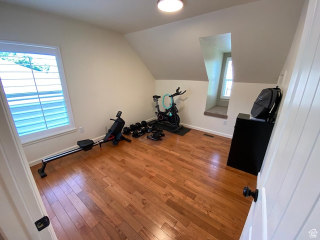 85 River Pointe Dr, Logan, UT 84321 - workout area with wood-type flooring, lofted ceiling, and baseboards