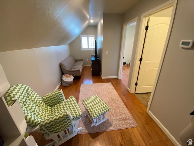 85 River Pointe Dr, Logan, UT 84321 - interior space featuring wood finished floors, vaulted ceiling, and baseboards
