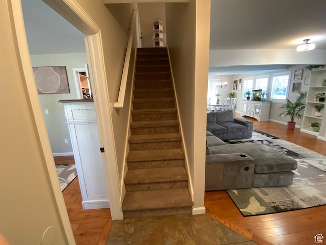 85 River Pointe Dr, Logan, UT 84321 - staircase featuring wood finished floors and baseboards