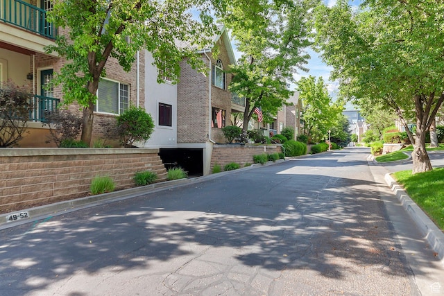 4910 N University Ave Unit 52, Provo, UT 84604 - view of asphalt road with a residential view and curbs