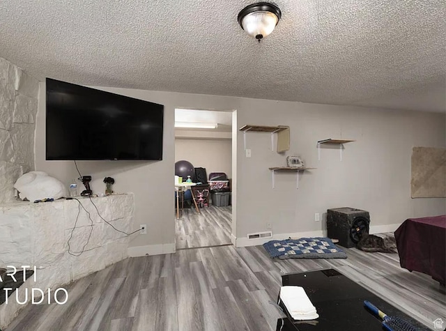 123 N 800 E, Payson, UT 84651 - living area with wood finished floors, a textured ceiling, and baseboards