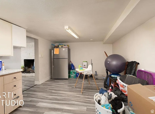 123 N 800 E, Payson, UT 84651 - playroom with light wood-type flooring, baseboards, and a stone fireplace