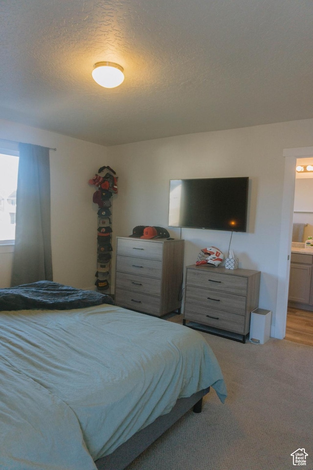 12959 S Penywain Ln W, Herriman, UT 84096 - carpeted bedroom featuring a textured ceiling and ensuite bathroom