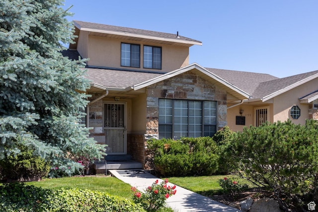 1155 E Murray Holladay Rd, Millcreek, UT 84117 - view of front of house featuring stucco siding, stone siding, and roof with shingles