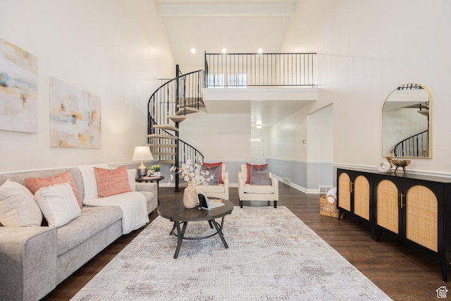 1155 E Murray Holladay Rd, Millcreek, UT 84117 - living room featuring stairway, wood finished floors, a towering ceiling, and baseboards