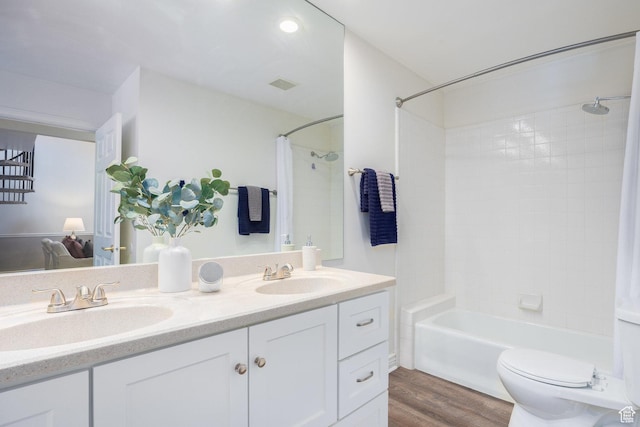 1155 E Murray Holladay Rd, Millcreek, UT 84117 - bathroom with double vanity, shower / bath combo with shower curtain, wood finished floors, and toilet