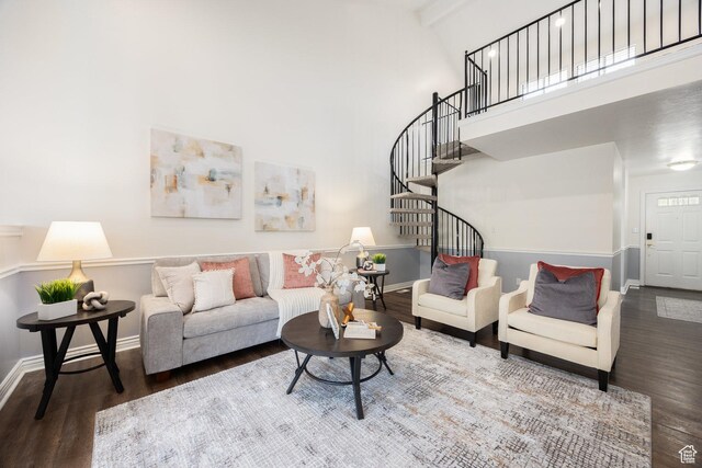 1155 E Murray Holladay Rd, Millcreek, UT 84117 - living room featuring wood finished floors, baseboards, stairway, and a towering ceiling