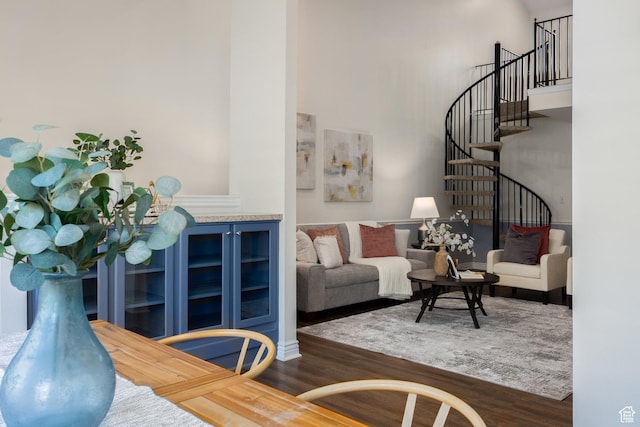 1155 E Murray Holladay Rd, Millcreek, UT 84117 - living area with wood finished floors, a high ceiling, and stairs