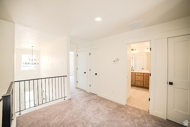 10926 S Little Sahara Dr Unit 1002, South Jordan, UT 84009 - corridor featuring a chandelier, light colored carpet, recessed lighting, and baseboards