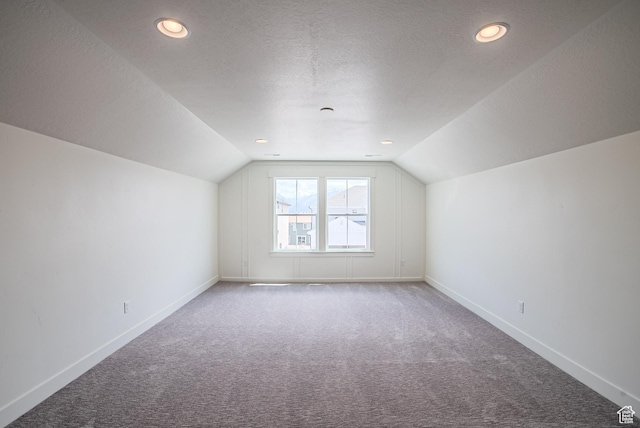 10926 S Little Sahara Dr Unit 1002, South Jordan, UT 84009 - additional living space featuring carpet, lofted ceiling, baseboards, a textured ceiling, and recessed lighting