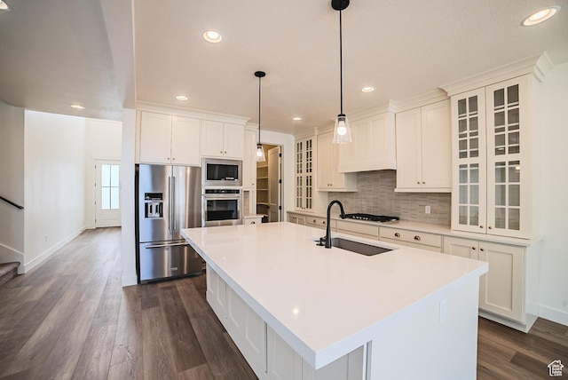 10926 S Little Sahara Dr Unit 1002, South Jordan, UT 84009 - kitchen with appliances with stainless steel finishes, a sink, dark wood-type flooring, recessed lighting, and backsplash