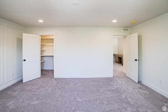 10926 S Little Sahara Dr Unit 1002, South Jordan, UT 84009 - unfurnished bedroom featuring carpet flooring, recessed lighting, a spacious closet, and baseboards
