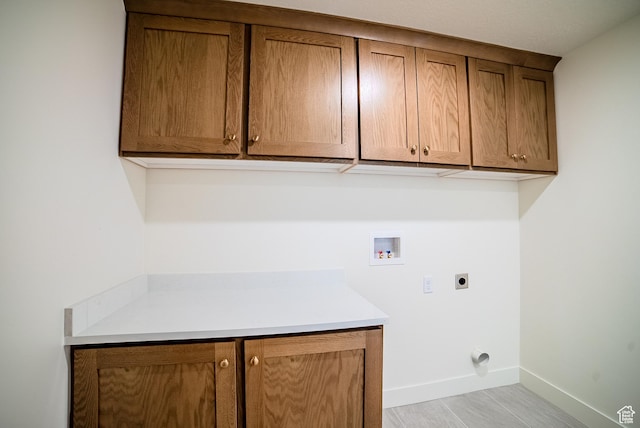 10926 S Little Sahara Dr Unit 1002, South Jordan, UT 84009 - laundry area with cabinet space, hookup for an electric dryer, washer hookup, and baseboards