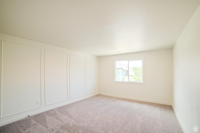 10926 S Little Sahara Dr Unit 1002, South Jordan, UT 84009 - spare room featuring light colored carpet and baseboards