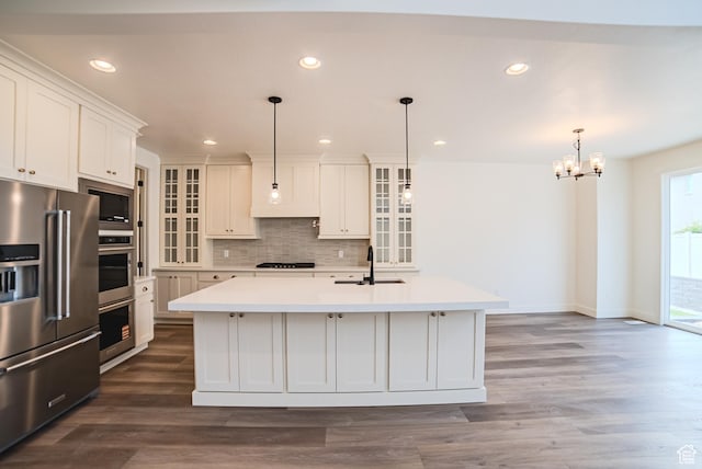 10926 S Little Sahara Dr Unit 1002, South Jordan, UT 84009 - kitchen with appliances with stainless steel finishes, light countertops, a chandelier, a sink, and recessed lighting