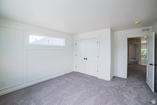 10926 S Little Sahara Dr Unit 1002, South Jordan, UT 84009 - unfurnished bedroom featuring carpet floors, a closet, and baseboards