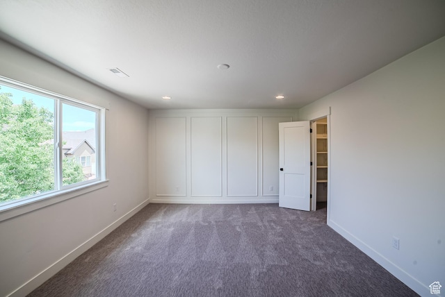 10926 S Little Sahara Dr Unit 1002, South Jordan, UT 84009 - unfurnished bedroom featuring baseboards, dark colored carpet, and recessed lighting