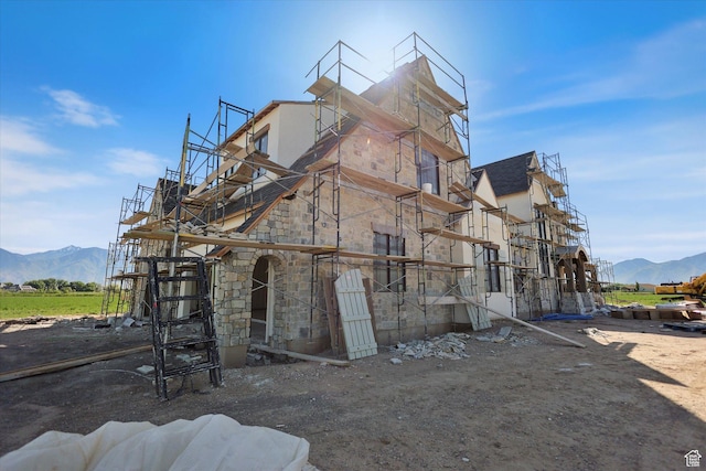 2556 W 5600 S, Lake Shore, UT 84660 - view of home's exterior with stone siding, a mountain view, and stucco siding