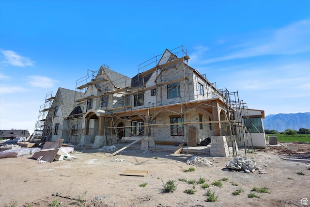 2556 W 5600 S, Lake Shore, UT 84660 - back of property featuring stone siding and a mountain view