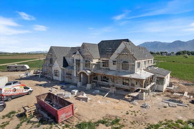 2556 W 5600 S, Lake Shore, UT 84660 - back of house with stone siding, a view of countryside, a mountain view, and roof with shingles