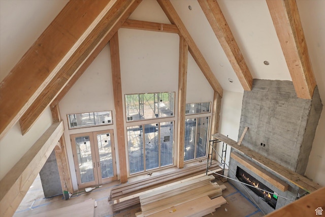 2556 W 5600 S, Lake Shore, UT 84660 - unfurnished living room featuring a lit fireplace and french doors