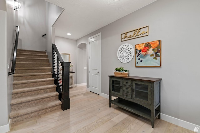 2914 E 1880 S, St George, UT 84790 - staircase with arched walkways, wood finished floors, baseboards, and recessed lighting
