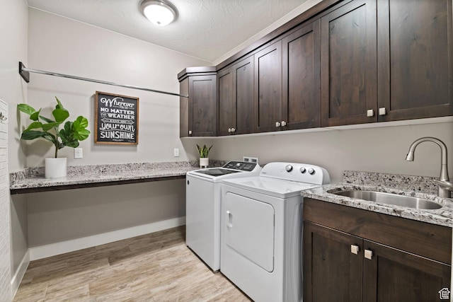 2914 E 1880 S, St George, UT 84790 - laundry area with independent washer and dryer, cabinet space, light wood finished floors, and baseboards