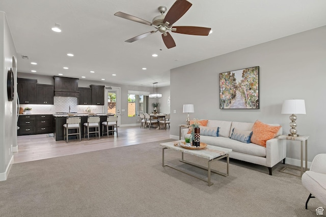 2914 E 1880 S, St George, UT 84790 - living room featuring baseboards, recessed lighting, light colored carpet, and ceiling fan