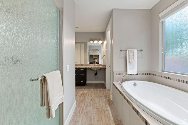 2914 E 1880 S, St George, UT 84790 - full bathroom with wood finished floors, a garden tub, baseboards, and vanity