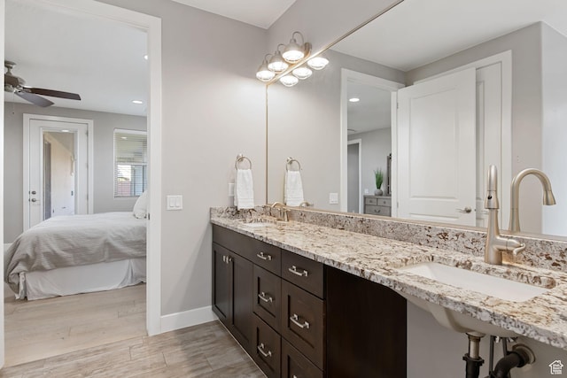 2914 E 1880 S, St George, UT 84790 - bathroom featuring ensuite bath, wood finished floors, double vanity, a ceiling fan, and recessed lighting
