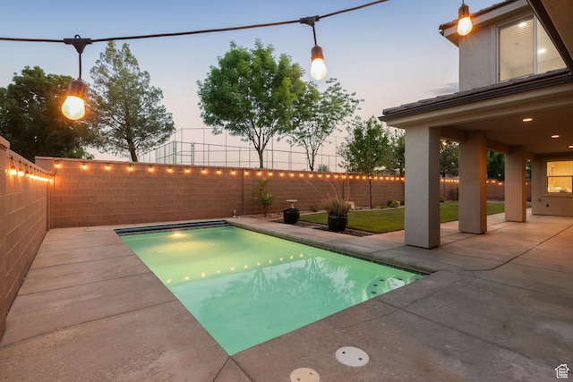 2914 E 1880 S, St George, UT 84790 - pool at dusk featuring a patio area and a fenced backyard