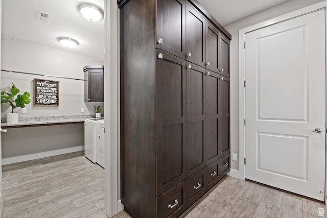 2914 E 1880 S, St George, UT 84790 - mudroom with washing machine and dryer, light wood-style floors, and baseboards