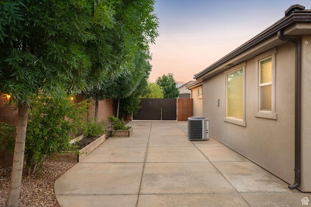 2914 E 1880 S, St George, UT 84790 - fenced backyard with central AC unit, a patio area, and a vegetable garden
