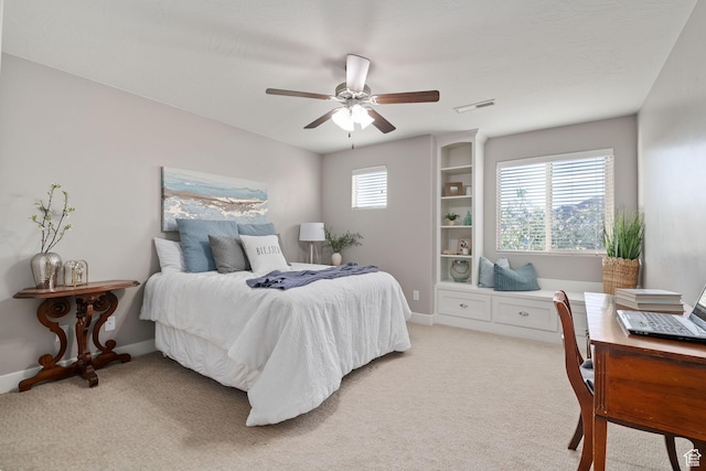 2914 E 1880 S, St George, UT 84790 - bedroom with light carpet, a desk, ceiling fan, and baseboards